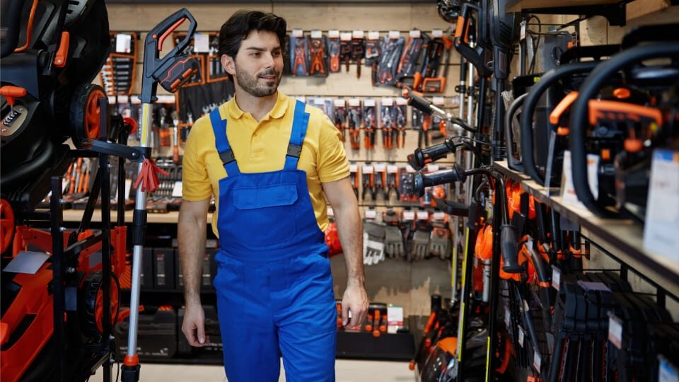 iman walking through an outdoor equipment shop.