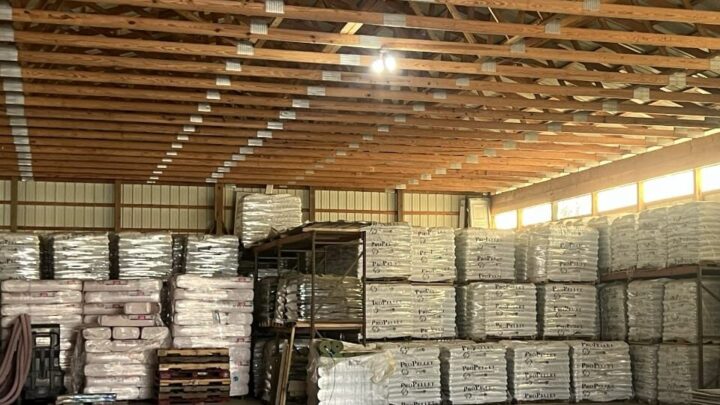Interior of an indoor lumber yard.