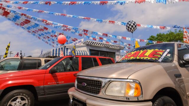 Used pickup trucks for sale at a used car lot.