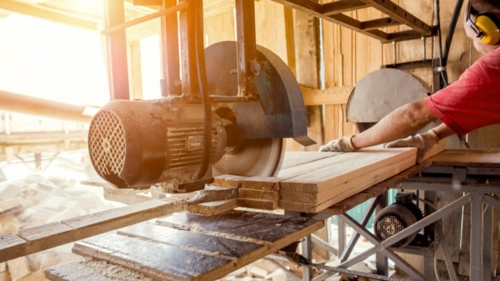 Cutting lumber in a woodshop.
